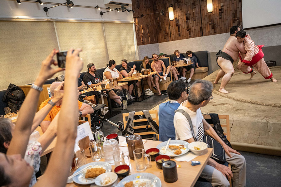 A fresh rush of foreign tourists are flocking to Japan for a look inside the insular world of sumo.
Image: Yuichi Yamazaki  / AFP 