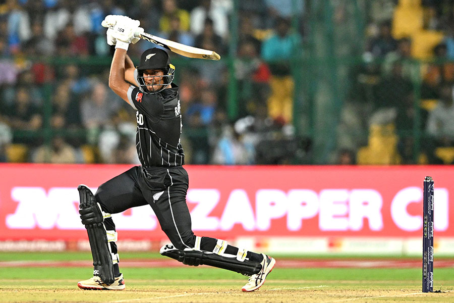 New Zealand's Rachin Ravindra reacts after playing a shot during the 2023 ICC Men's Cricket World Cup one-day international (ODI) match between New Zealand and Sri Lanka at the M. Chinnaswamy Stadium in Bengaluru on November 9, 2023. Image: R.Satish Babu / AFP