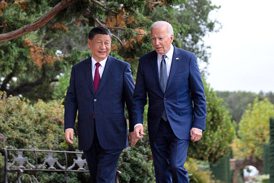 US President Joe Biden (R) and Chinese President Xi Jinping walk together after a meeting during the Asia-Pacific Economic Cooperation (APEC) Leaders' week in Woodside, California on November 15, 2023. Image: Brendan Smialowski / AFP 