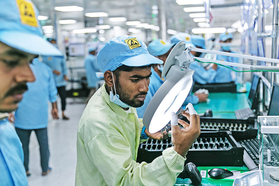 Technicians working in electronics manufacturing company, Dixon Technologies based in Noida. It is a contract manufacturer of televisions, washing machines, smartphones, LED bulbs, battens, downlighters and CCTV security systems for companies such as Samsung, Xiaomi, Panasonic and Philips.  Image credit: Madhu Kapparath 