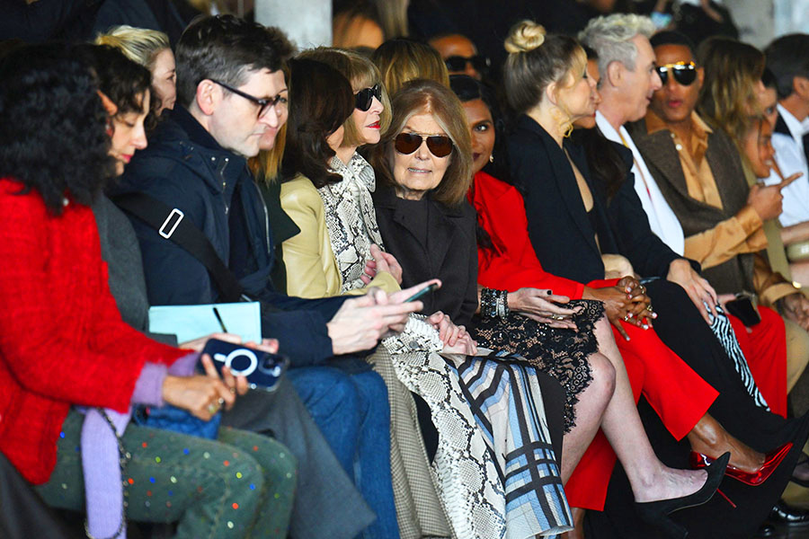 US journalist Gloria Steinem speaks to New York State Governor Kathy Hochul and English magazine editor Anna Wintour as they attend the Michael Kors runway show during New York Fashion Week in New York City on February 15, 2023. Image Credit: Photography ANGELA WEISS / AFP