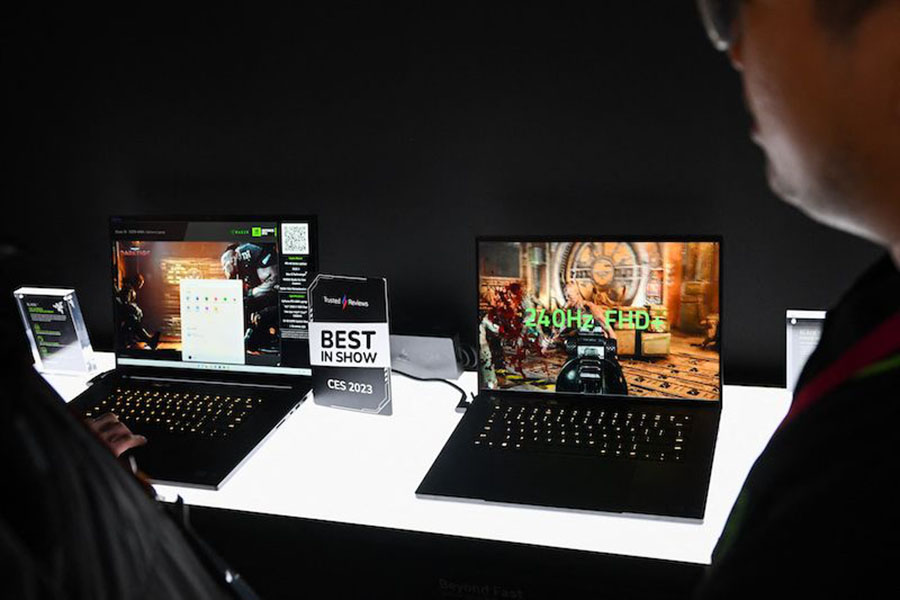 A Razer Blade 18 laptop (L) for video gaming is displayed at the Razer Inc. booth during the Consumer Electronics Show (CES) in Las Vegas, Nevada, on January 6, 2023. Image: Patrick T. Fallon / AFP 