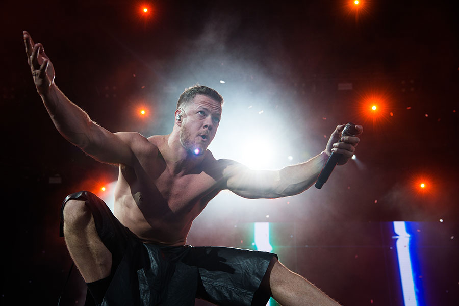 Dan Reynolds from Imagine Dragons performs at Hippodrome de Longchamp, for Lollapalooza Paris in July 2022; Photo by David Wolff-Patrick/Getty Images