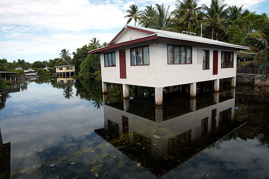 Tuvaluans fear that global warming-induced changes in sea level coupled with king tides and cyclones will soon render their Polynesian archipelago uninhabitable. Image: AFP PHOTO/Torsten BLACKWOOD©