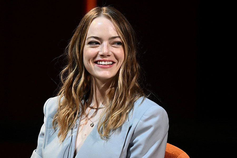 Emma Stone's movie 'Poor Things' will premier at Venice Film Festival, but the actor is not likely to appear for the release. Image: Aris MESSINIS / AFP