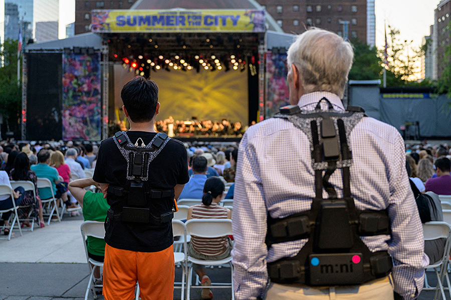 The aim of the vests—along with bands at the wrists or ankles—is to allow for a full-body experience, creating sensations that render the feelings music can evoke. Image: Angela Weiss / AFP