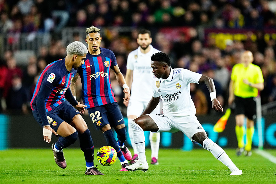 Vinicius Junior left winger of Real Madrid and Brazil and Ronald Araujo centre-back of Barcelona and Uruguay compete for the ball during the La Liga Santander match between FC Barcelona and Real Madrid CF at Spotify Camp Nou on March 19, 2023 in Barcelona, Spain; Image: Jose Breton/Pics Action/NurPhoto via Getty Images

