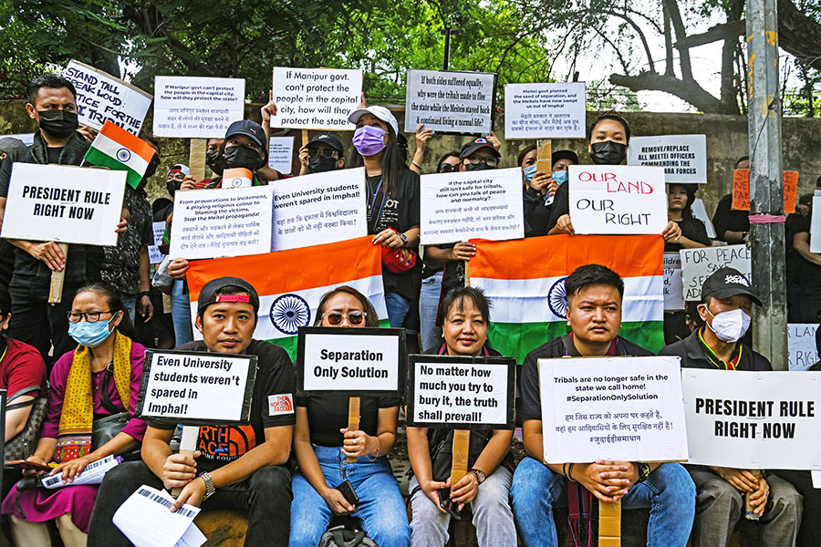 Members of the Kuki tribe hold Indian Flags and Placards in a protest against the killings of tribals in the North Eastern state of Manipur, in New Delhi, India on May 31, 2023; Image: Kabir Jhangiani/NurPhoto via Getty Images