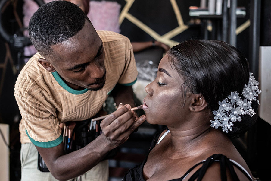 Djibril Gueye, also known as Djibou, the most popular Central African makeup artist, applies final touches to a bride-to-be at his beauty salon in Bangui.
Image: Barbara Debout / AFP 