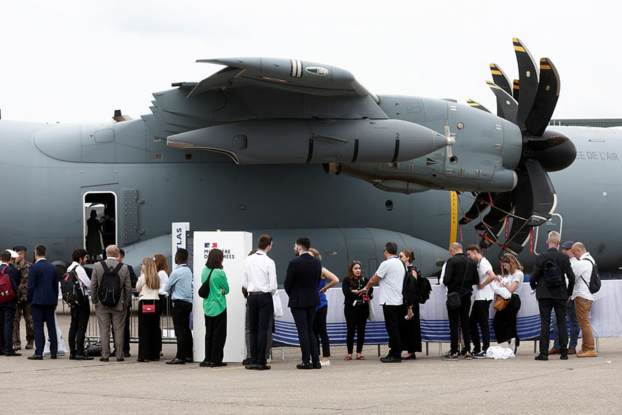 Visitors queue up to board a French Air Force Airbus SE A400M, a four-engine turboprop military transport aircraft.