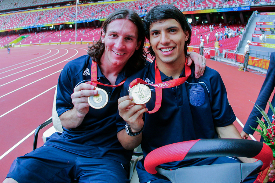 Argentinian forwards Lionel Messi and Sergio Aguero show off their gold medals at the Beijing 2008 Olympic Games on August 23, 2008, in Beijing, China