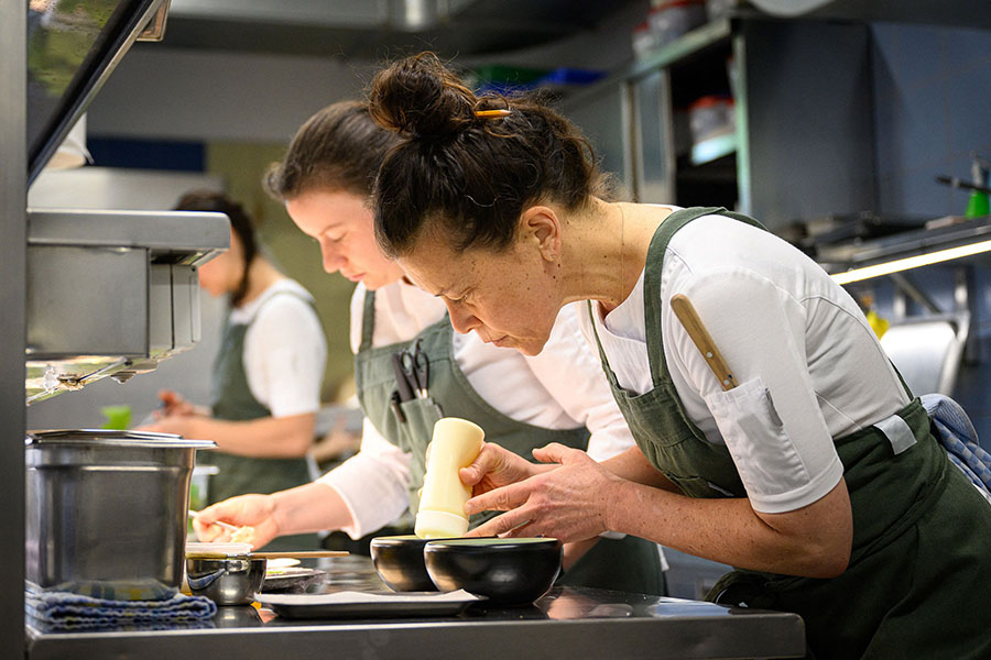  Hisa Franko restaurant's head chef Melle Simon (R) preparing a Slovenian dish in Kobarid
Image: Jure Makovec / AFP 