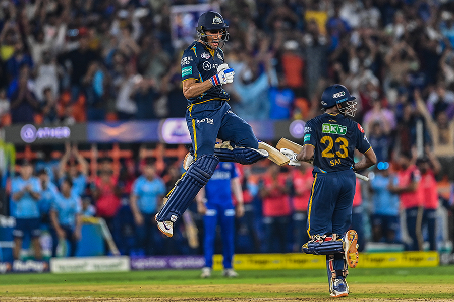 Gujarat Titans' Shubman Gill (L) celebrates after scoring a century (100 runs) during the Indian Premier League (IPL) T20. This was the second qualifier cricket match held between Mumbai Indians and Gujarat Titans at the Narendra Modi Stadium in Ahmedabad on May 26, 2023. Image: Sajjad Hussain/AFP 