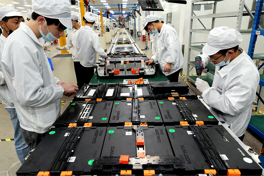 Workers at a factory for Xinwangda Electric Vehicle Battery Co. Ltd, which makes lithium batteries for electric cars and other uses, in Nanjing in China's eastern Jiangsu province 
Image: STR / AFP 