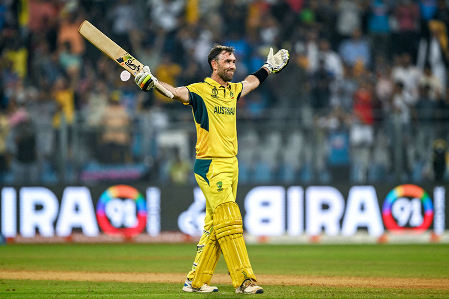 Australia's Glenn Maxwell celebrates after winning the 2023 ICC Men's Cricket World Cup one-day international (ODI) match between Australia and Afghanistan at the Wankhede Stadium in Mumbai on November 7, 2023. 
Image: Indranil Mukherjee / AFP  