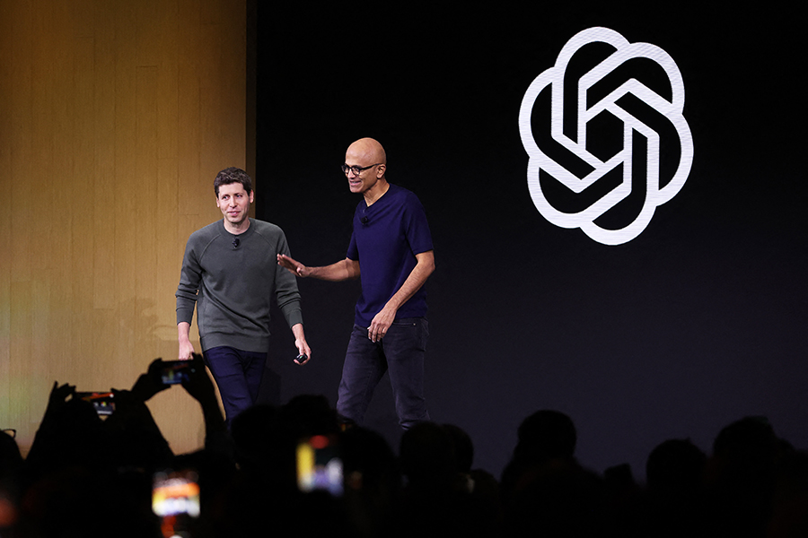 Microsoft CEO Satya Nadella (R) greets OpenAI CEO Sam Altman during the OpenAI DevDay event on November 06, 2023 in San Francisco, California. Altman delivered the keynote address at the first-ever Open AI DevDay conference.   Image: Justin Sullivan/Getty Images/AFP