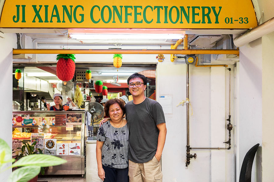 Kelvin Toh Aik Leong and his mother outside their family shop in Everton.