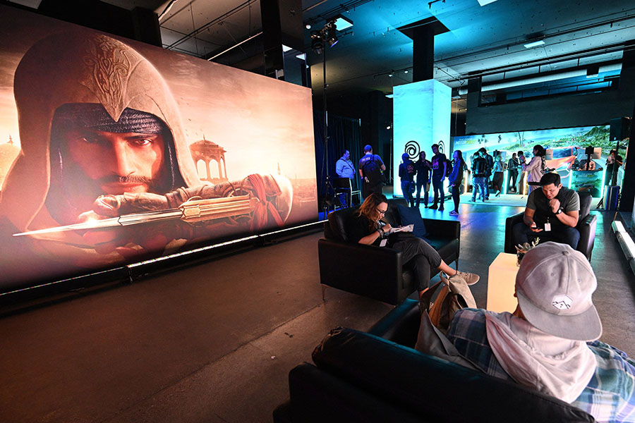 People attend the Ubisoft Forward livestream event in Los Angeles, California, on June 12, 2023. The event features a look at upcoming Ubisoft games. Image: Robyn Beck / AFP 