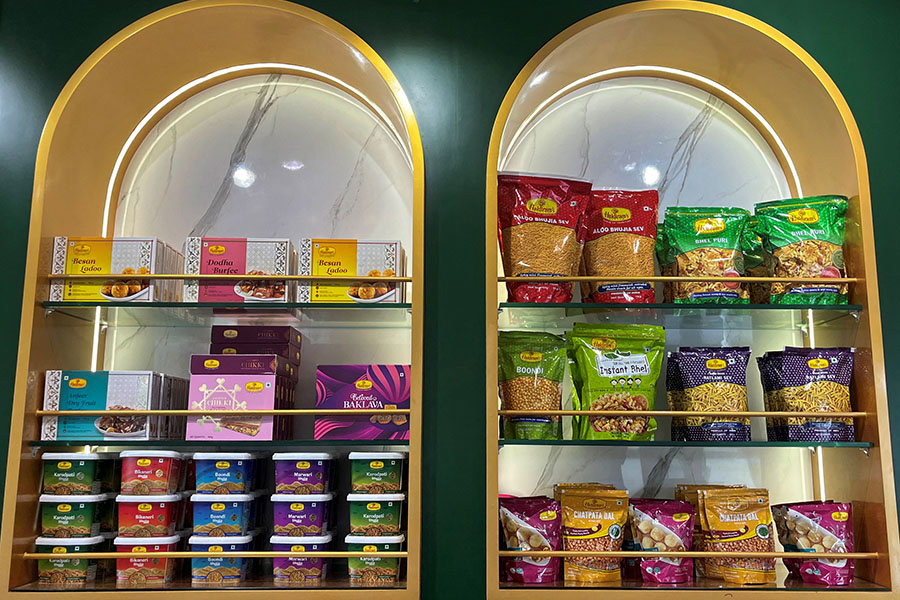 A view shows packets of snacks on the shelves inside a Haldiram's restaurant in Mumbai, India. Image: M Sriram/Reuters