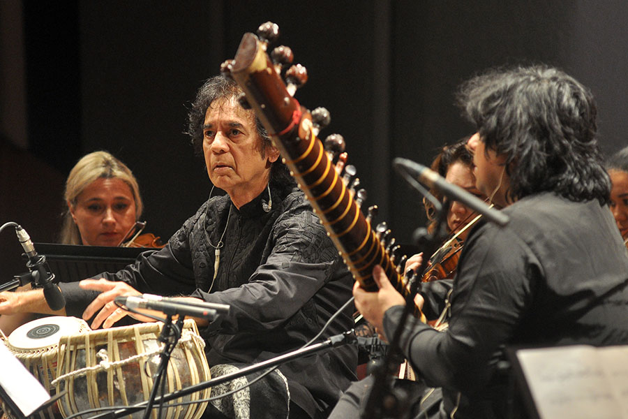 Zakir Hussain, who has collaborated with musicians across generations and genres, believes the key to a successful collaboration lies in the mindset of collective performance. Even in this concerto, he has left space for Kumar and Chaurasia to interpret parts of the score. Image: Courtesy: NCPA 