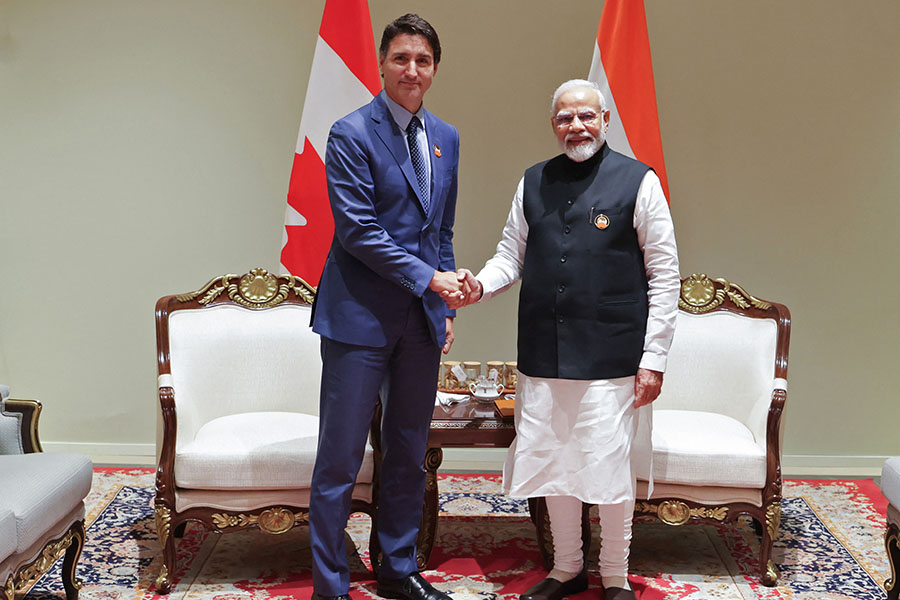 India's Prime Minister Narendra Modi (R) and his Canada counterpart Justin Trudeau shake hands during a bilateral meeting after the G20 Summit in New Delhi on September 10, 2023. Image: PIB / AFP