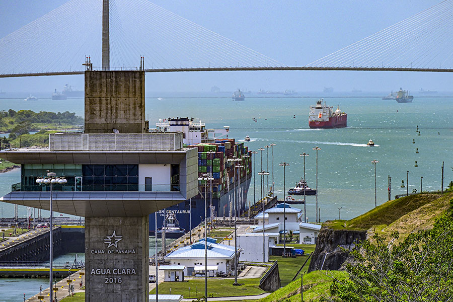 A cargo ship passes through the Panama Canal's Agua Clara locks on Gatun Lake in Colon, Panama, on April 14, 2024. The number of ships allowed through the drought-hit Panama Canal each day will be increased thanks to signs of an improvement in water levels, authorities said on April 15, 2024. 
Image: Martin Bernetti / AFP 