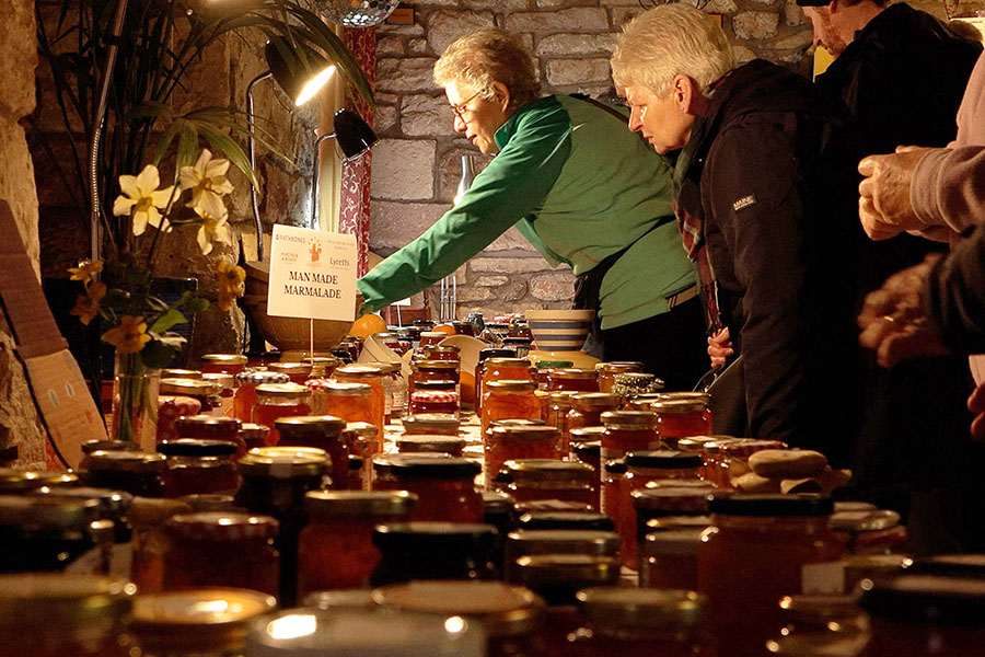 

A screenshot taken from an AFP TV video, shows people browsing jars of marmalade entered into the annual Dalemain world marmalade awards, in Penrith. Photography Justine GERARDY / AFP©