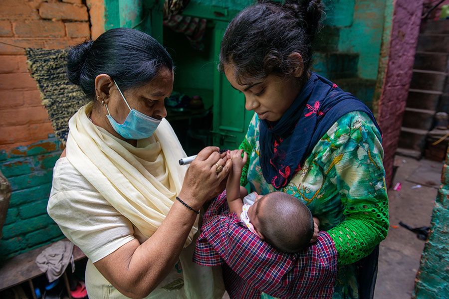 A file photo of Asha worker on her rounds administering polio vaccine. Image: Shutterstock
