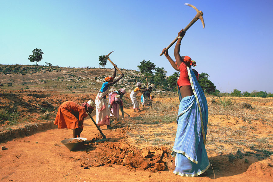 A file photo of tribal villagers excavating barren land under a rural welfare employment programme in Jharkhand. Image: Shutterstock