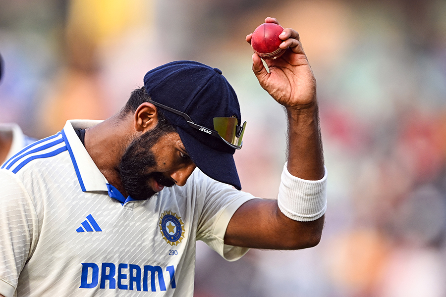 India's Jasprit Bumrah shows a ball after taking 6 wickets at the end of England's inning during the second day of the second Test cricket match between India and England at the Y.S. Rajasekhara Reddy Cricket Stadium in Visakhapatnam on February 3, 2024. Image: Dibyangshu Sarkar/ AFP 