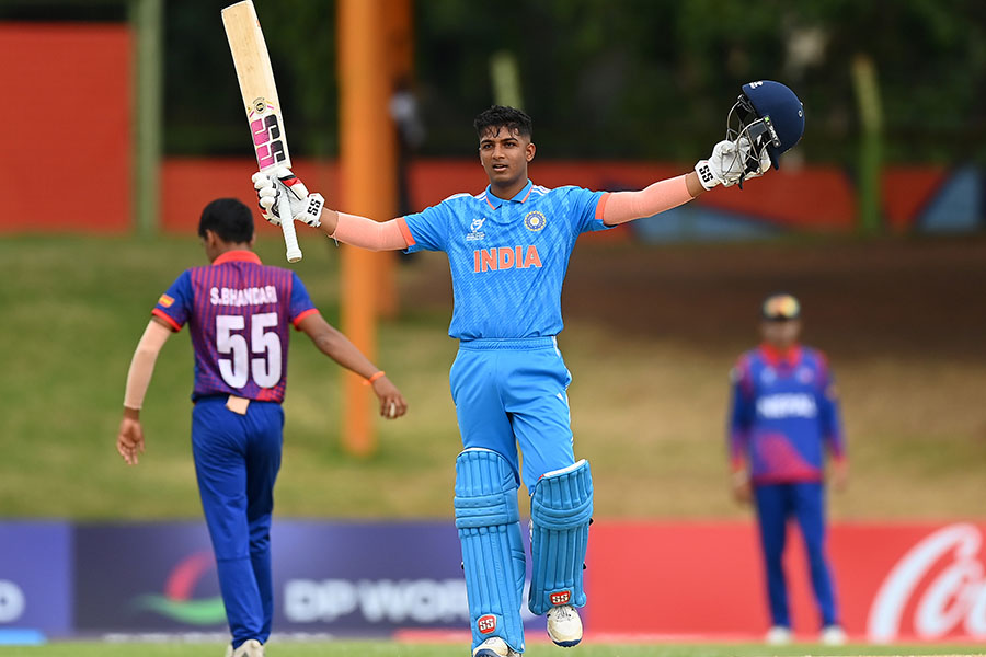 Sachin Dhas of India raises his bat and helmet as he celebrates after reaching his century during the ICC U19 Men's Cricket World Cup South Africa 2024 Super Six match between India and Nepal at Mangaung Oval on February 02, 2024 in Bloemfontein, South Africa.
Image: Alex Davidson-ICC/ICC via Getty Images