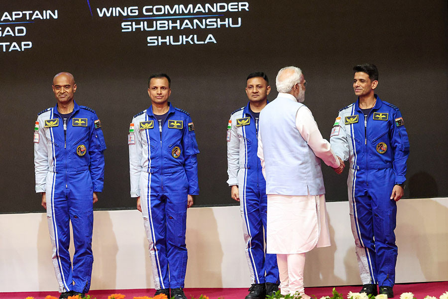 PM Modi with the four chosen astronauts, three of whom will man the Gaganyaan mission. Image: PIB