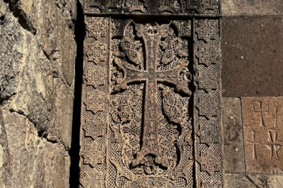  The cave church within the grounds of Geghard Monastery proudly displays four medieval khachkars carved in the 12th century, embedded in its walls amidst the mountainous terrain
Image: Shutterstock