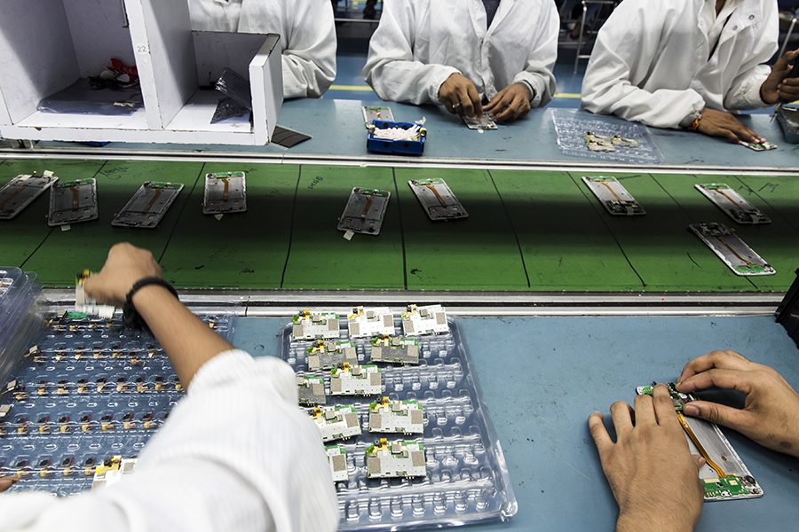 This is an important policy change towards export-led growth, and is expected to help scale up mobile manufacturing in India. Image: Udit Kulshrestha/Bloomberg via Getty Images