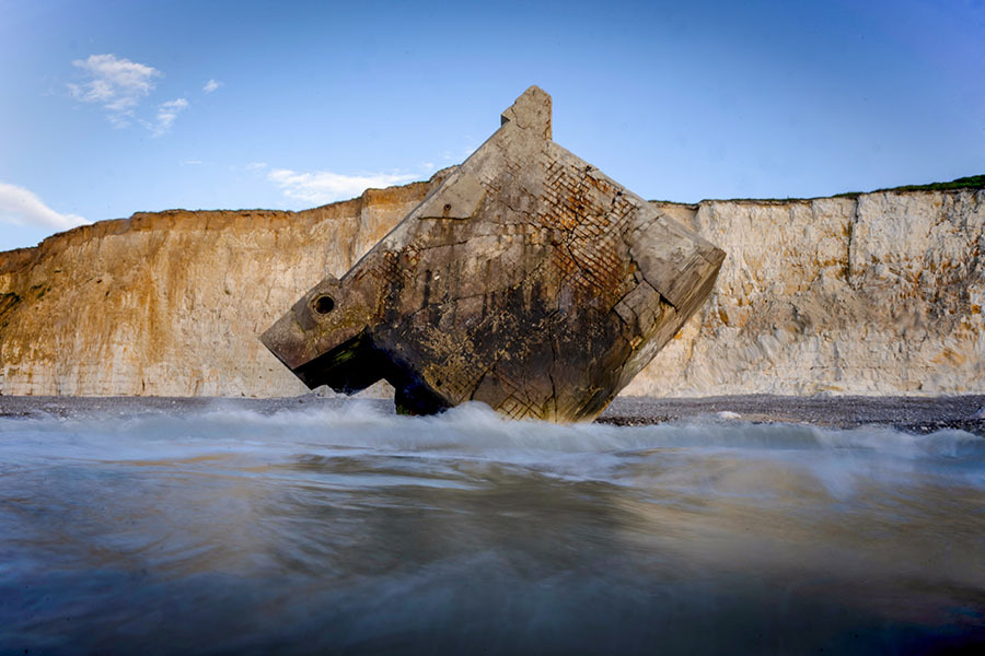 This photograph shows a bunker (Blockhaus) from the Atlantic Wall that fell after cliffs collapsed near Sainte Marguerite-sur-Mer, northern France, on May 15, 2024. Image: Olivier MORIN / AFP