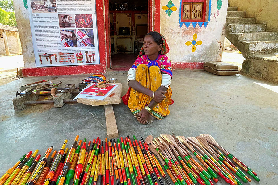 On the left - samples of Rogan art in Nirona Village. On the right - Artist Abdul Gafur shows us a variety of pre-painted Rogan designs.