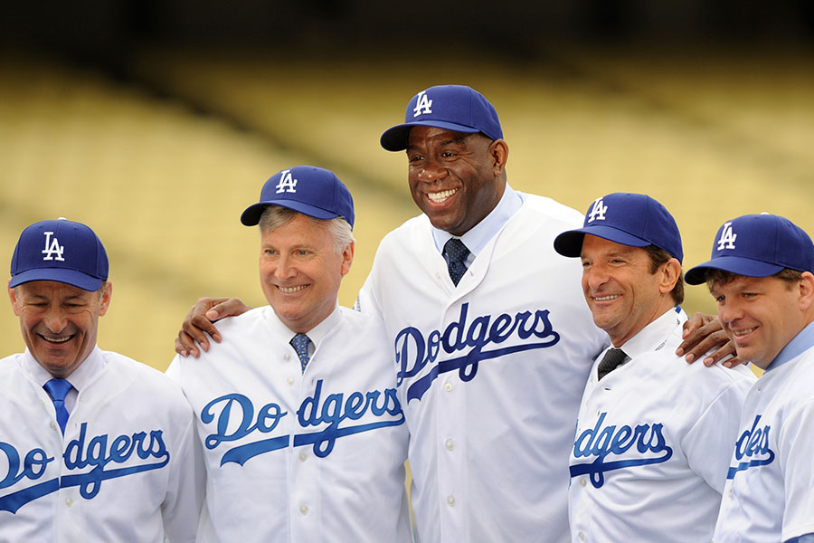 (From left) Members of the Los Angeles Dodgers’ owners group: President Stan Kasten, Guggenheim CEO Mark Walter, basketball great Earvin “Magic” Johnson, film producer
Peter Guber and Boehly. Clever financing could lead to another World Series title in 2024