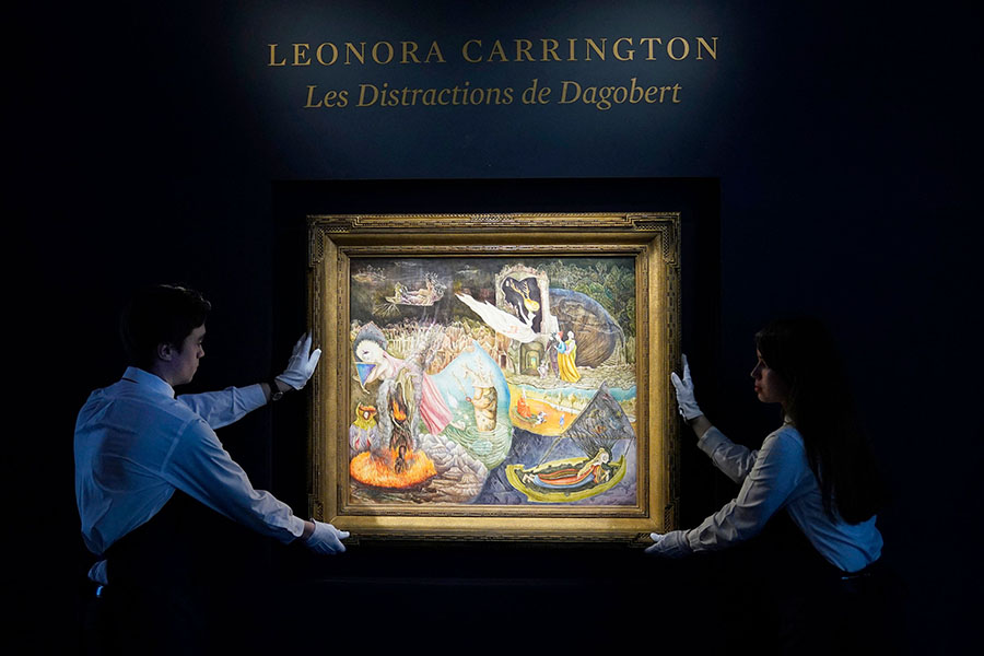 Sotheby’s art handlers hold Leonora Carrington's “Les Distractions de Dagobert