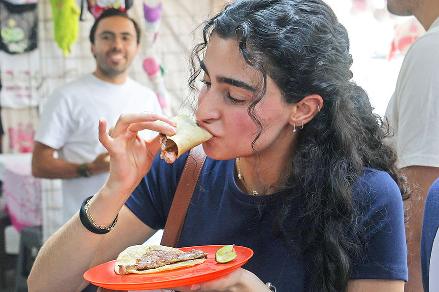 A woman eats tacos at Taqueria restaurant El Califa de Leon in Mexico City on May 15, 2024. Image credit: Photography Silvana FLORES / AFP©