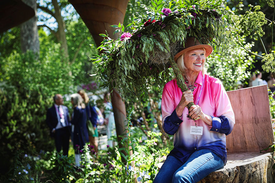

British Television presenter Anneka Rice poses for photographs in The Water Aid Garden during the preview day at the RHS Chelsea Flower show, in London. Image: Adrian Dennis / AFP©