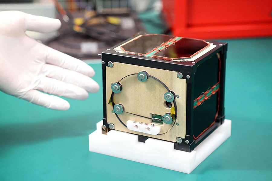 
The world's first wooden satellite made from wood and named LignoSat, developed by scientists at Kyoto University and logging company Sumitomo Forestry, is shown during a press conference at Kyoto University in Kyoto.
Image: STR / JIJI Press / AFP©